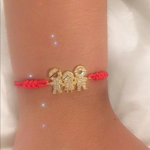 Red Bracelet with a goldfilled charm